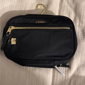 TUMI Black Toiletry Bag with Gold Accents